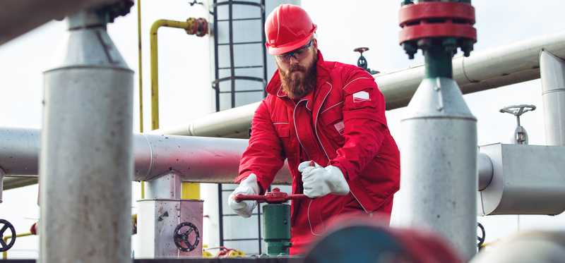 A person working on a pipeline.