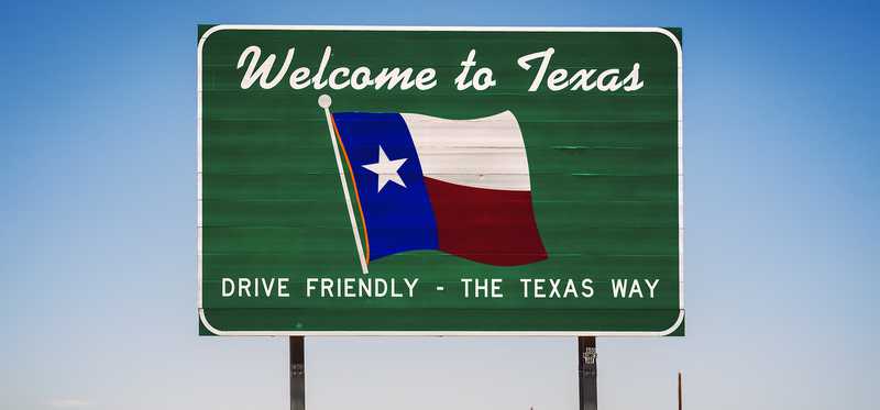 Sign saying Welcome to Texas, Drive Friendly -- The Texas Way.