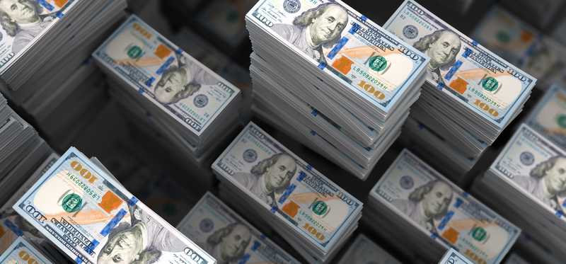 Several piles of bundled cash.