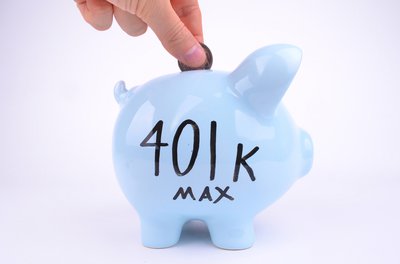 Blue piggy bank with 401k Max written on its side.