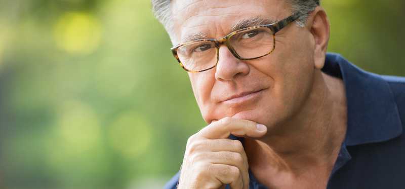 A person with hand on chin.