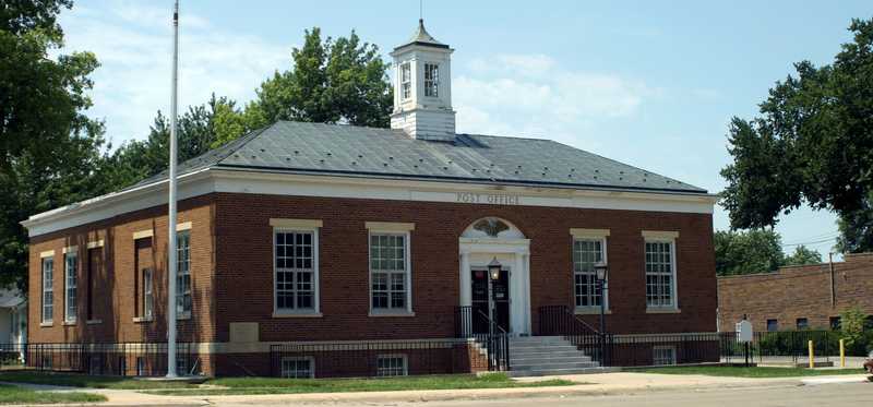 An exterior view of a typical older Post Office building.