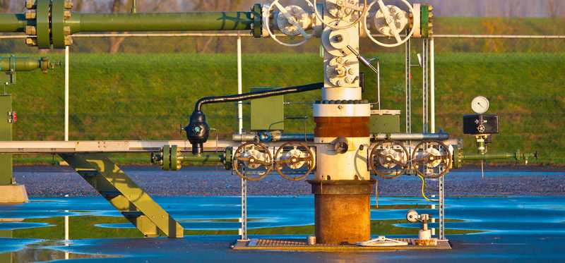 A natural gas wellhead after it rained.