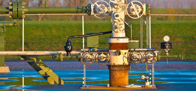 A natural gas wellhead after it rained.