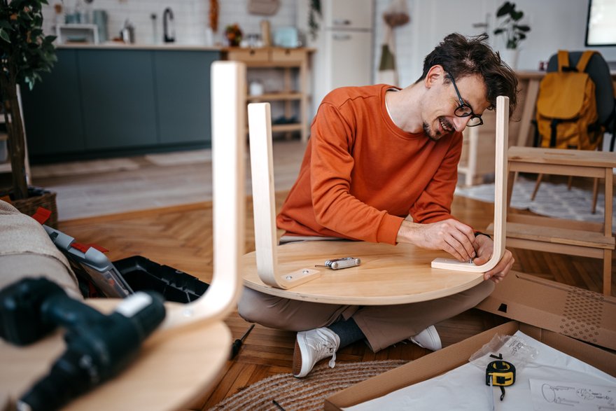 A person building furniture.