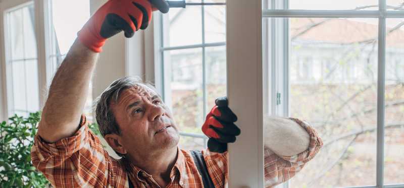 A person fixing a door.