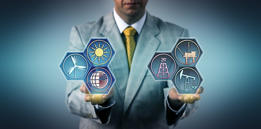 A person holding energy industry icons in their hands.