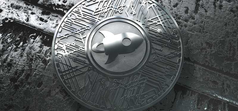A physical silver Stellar Lumens coin on a silver background.