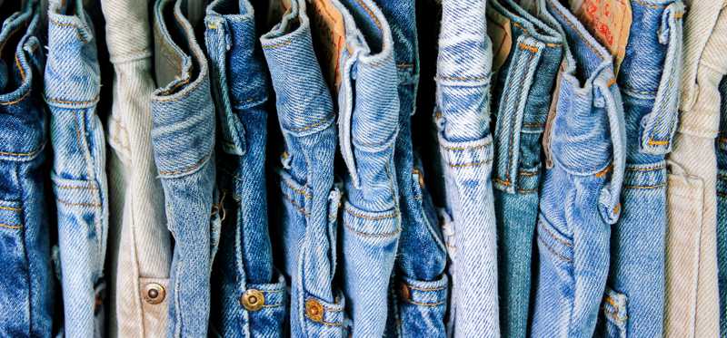 A rack of second-hand jeans.