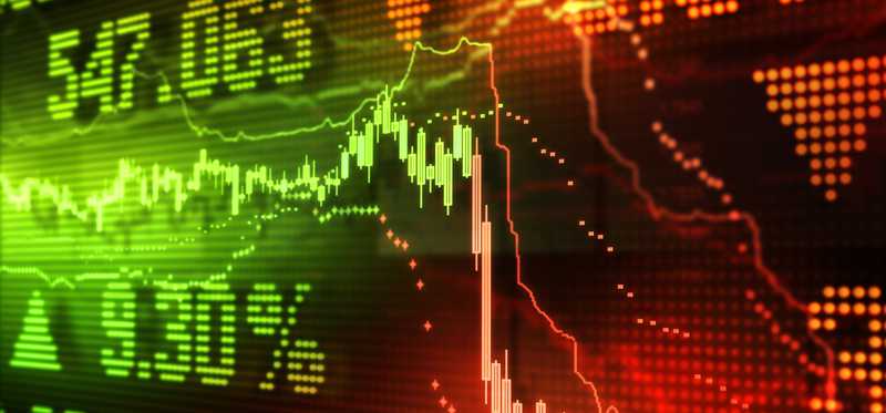 A stock chart hovering in the green, then plunging deep into the red, with percentages and stock quotes in the background.