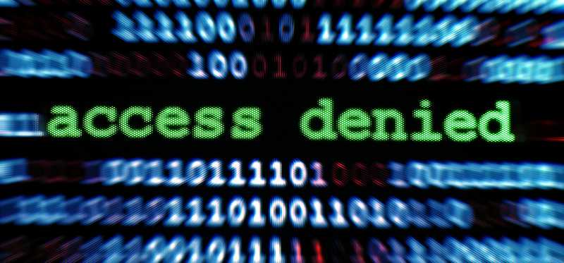 Digital text that says "access denied" amongst a lot of 1s and 0s