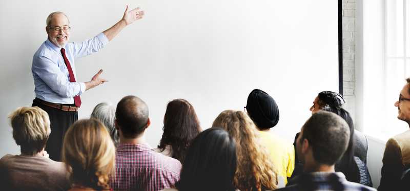 Adults in a classroom facing the instructor
