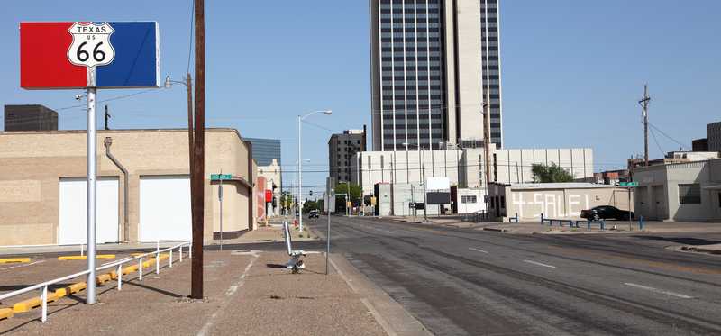 A tall building and Route 66 sign in Amarillo, Texas.