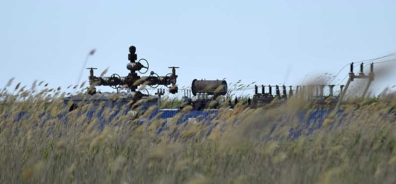 An oil and gas well in a field.