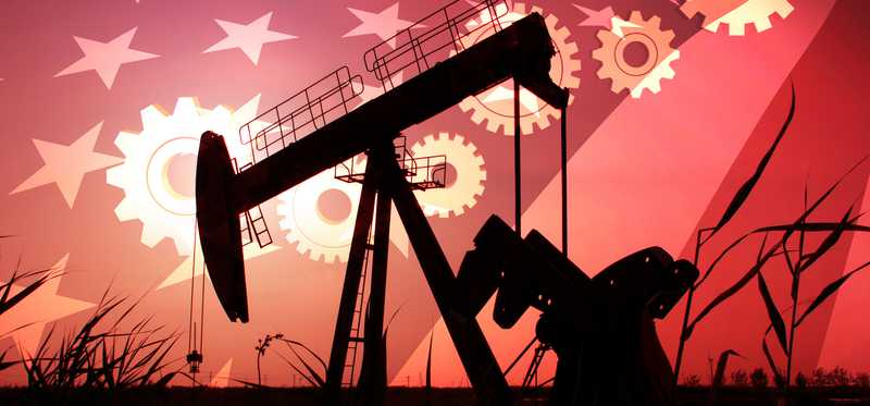 An oil pump with an American flag in the background.