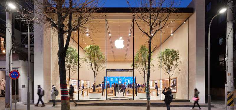 View of Apple store from outside at night time.