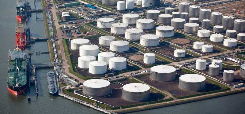 An aerial view of an oil terminal in a harbor.