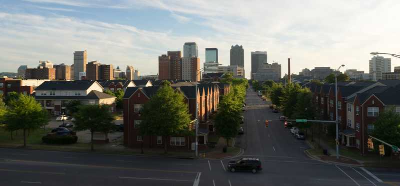 Residential city street and city skyline in Birmingham, Alabama.