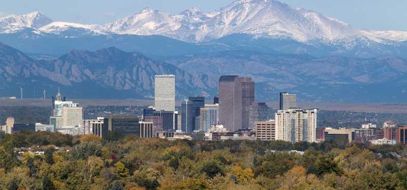 Aerial view of Boulder, Colorado, with mountains in the background.