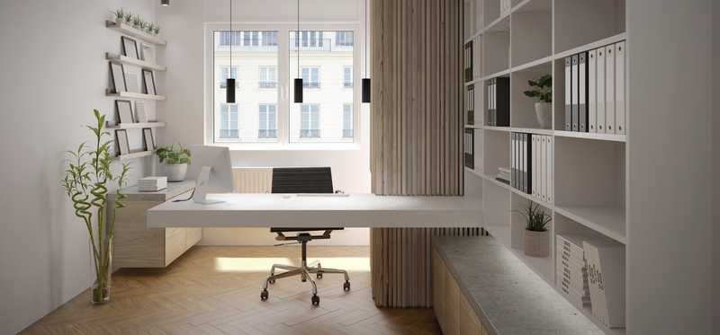 A modern home office with built-in shelves and desk.