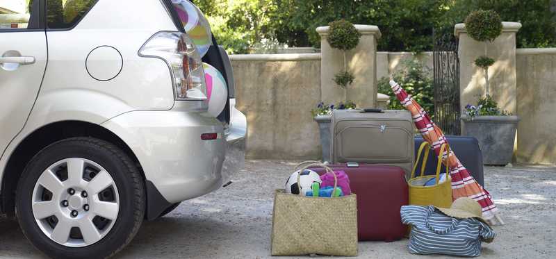 Car with open back end and beach gear