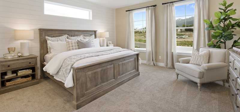 A cozy carpeted bedroom.