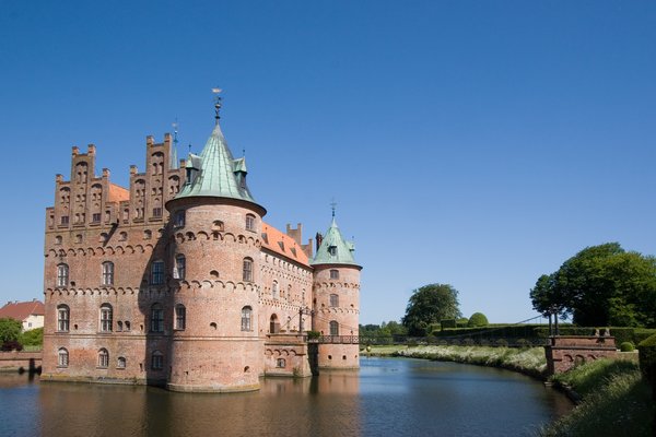A castle surrounded by a moat.