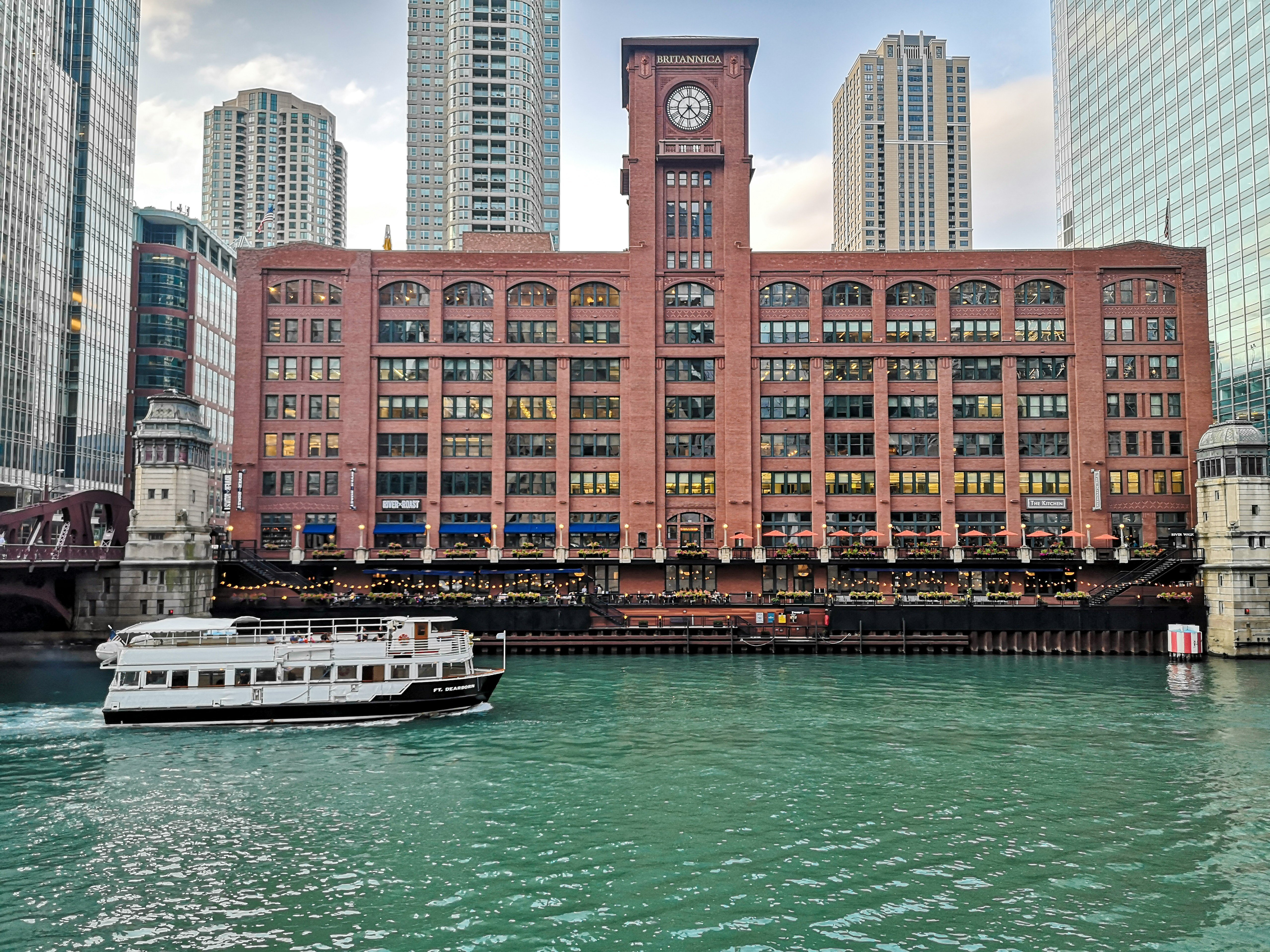 A ferry going down a river in Chicago