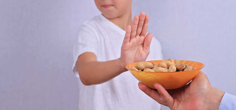 Child turning down peanuts.