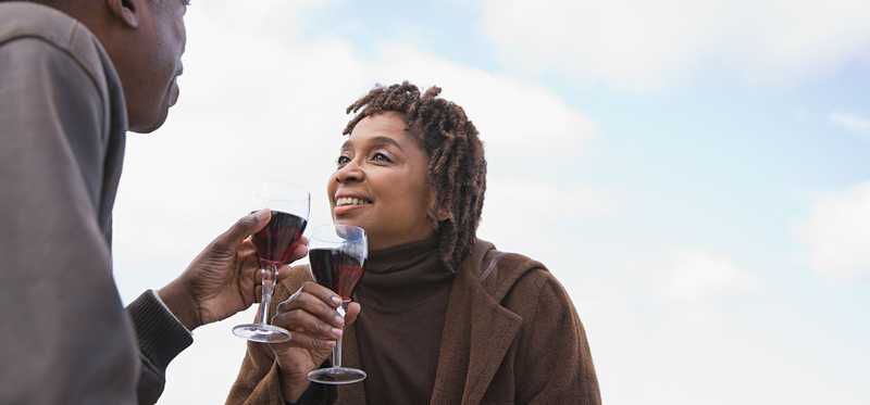 Two people drinking wine together.