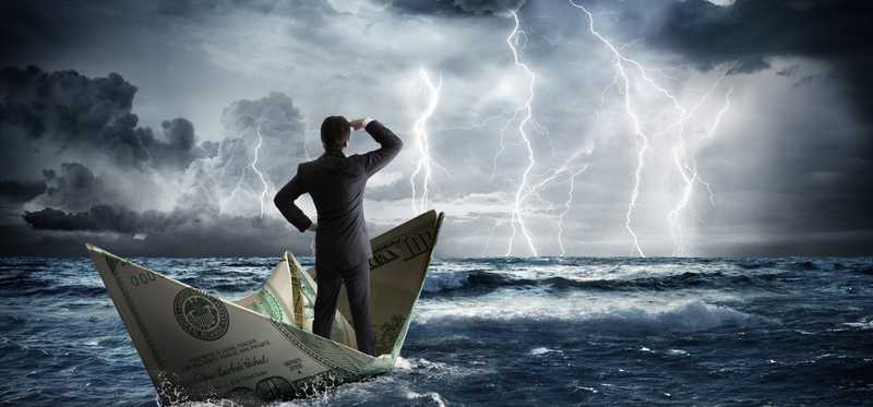 Businessperson on boat made out of hundred dollar bill looks at lightning storm.