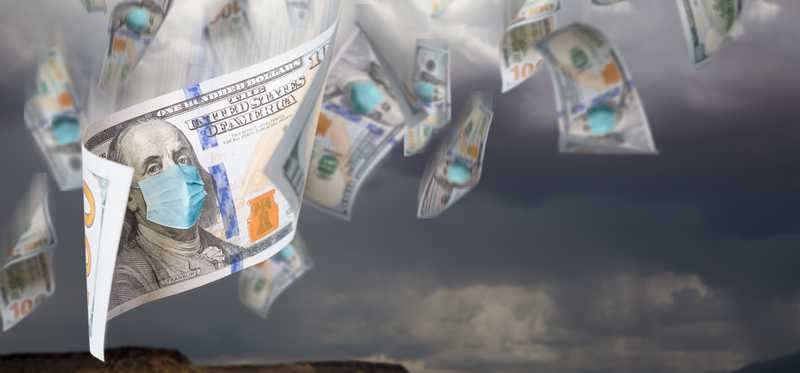 Hundred dollar bills showing masked Ben Franklin fly through the air against stormy sky