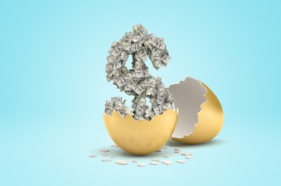 Dollar sign made of dollar bills rising out of cracked golden egg