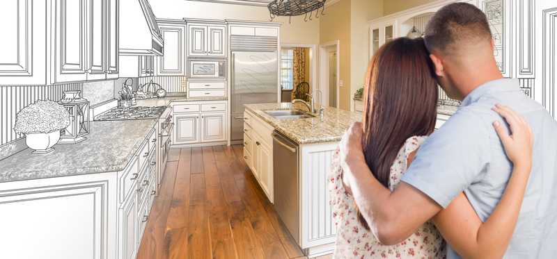 Couple envisioning their finished kitchen remodel.