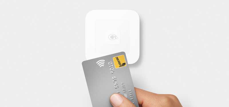 Credit card with Square contactless payment device.