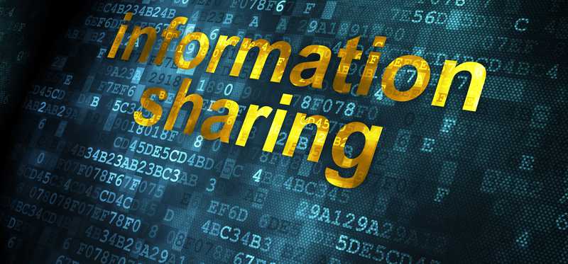 The words "information sharing" overlaid on digital code and a dark background.