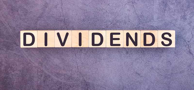 Dividends spelled out in wooden blocks.