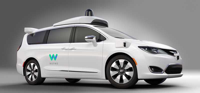 A white Waymo self-driving car