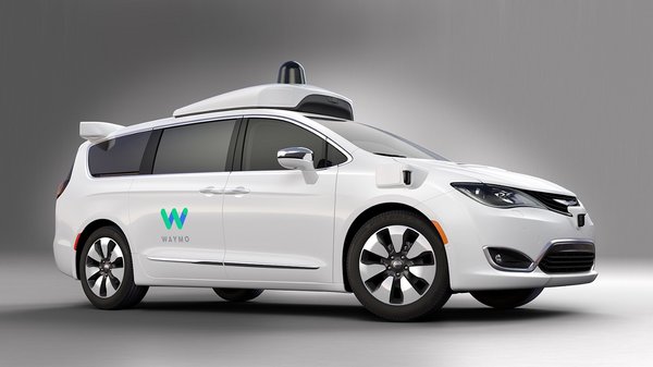 A white Waymo self-driving car
