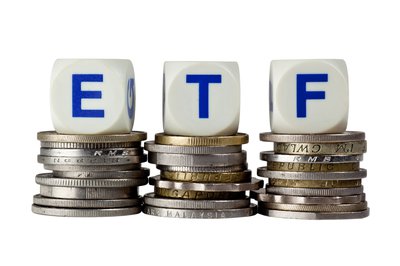 Dice spelling ETF on stacks of coins
