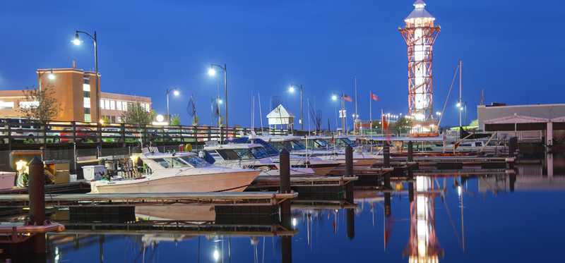A lighthouse and boat dock in a view of Erie, Pennsylvania.