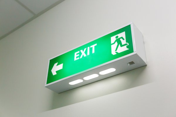 A green exit sign with arrow.