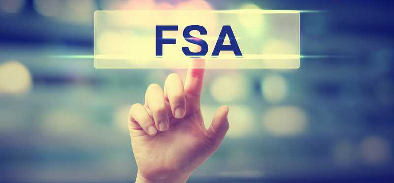 Finger pointing to digital FSA button in the air.