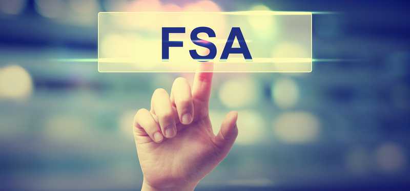 Finger pointing to FSA button on a digital board.