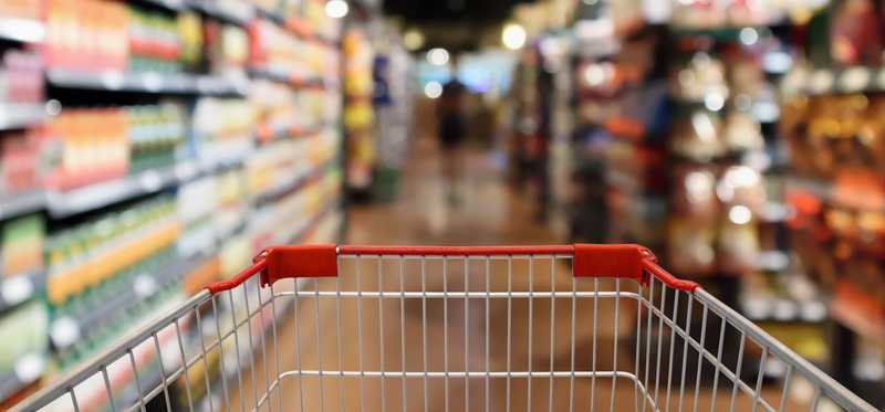 This is a shopping cart being pushed around a grocery store.