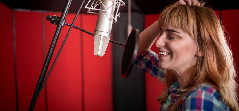 Female talking into microphone.