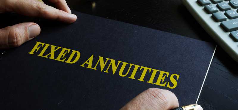 A fixed annuities book sits on a table.