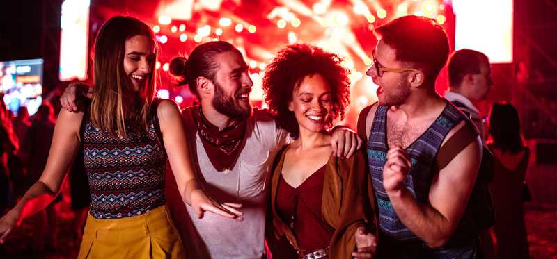 Four friends at concert.