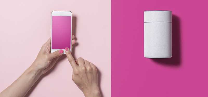 Smart Speaker over a pink background, and a smart phone with a light-pink background.