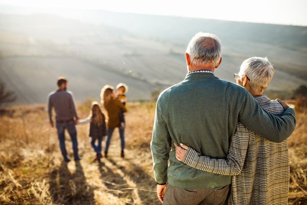 Multigenerational family gathered in a field